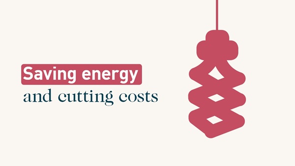 Energy saving light bulb. Text: Saving energy and cutting costs
